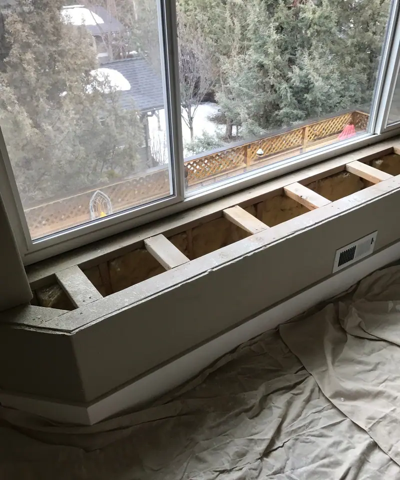 Bay-window plant shelf framed in lumber before the drywall goes on