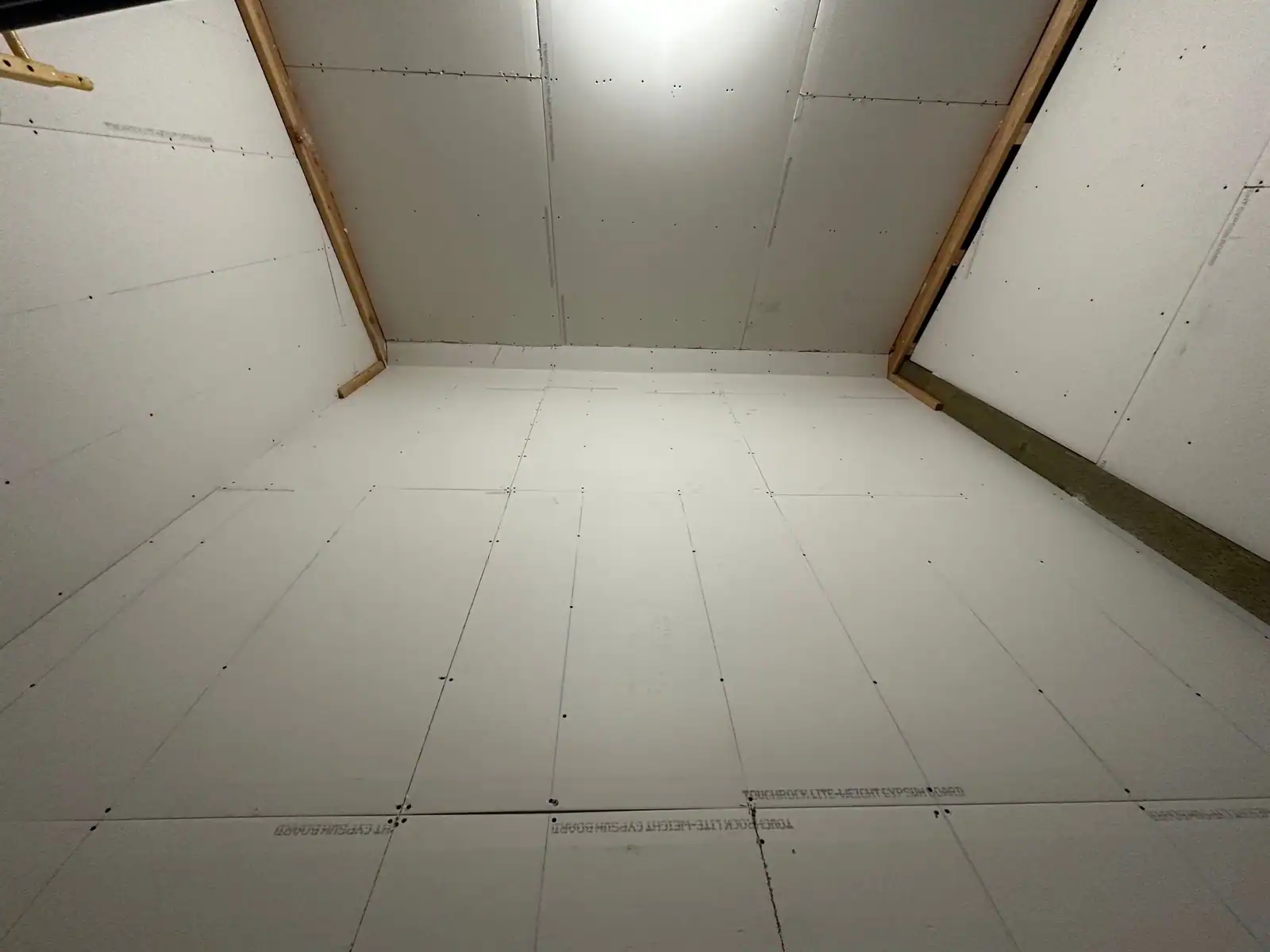 Looking up at a vaulted ceiling fully hung in drywall by Danny Patches Custom Drywall