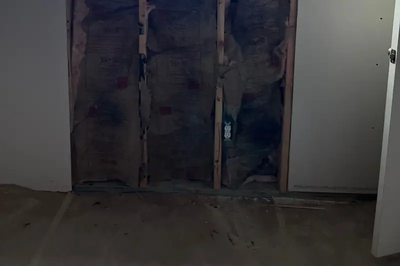 Wall hung in drywall around an open knee wall under a new window