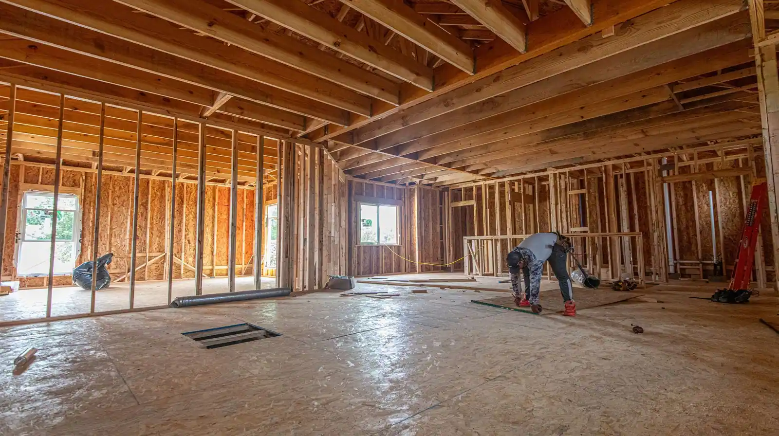 Wood-framed house interior at rough-in, ready for drywall