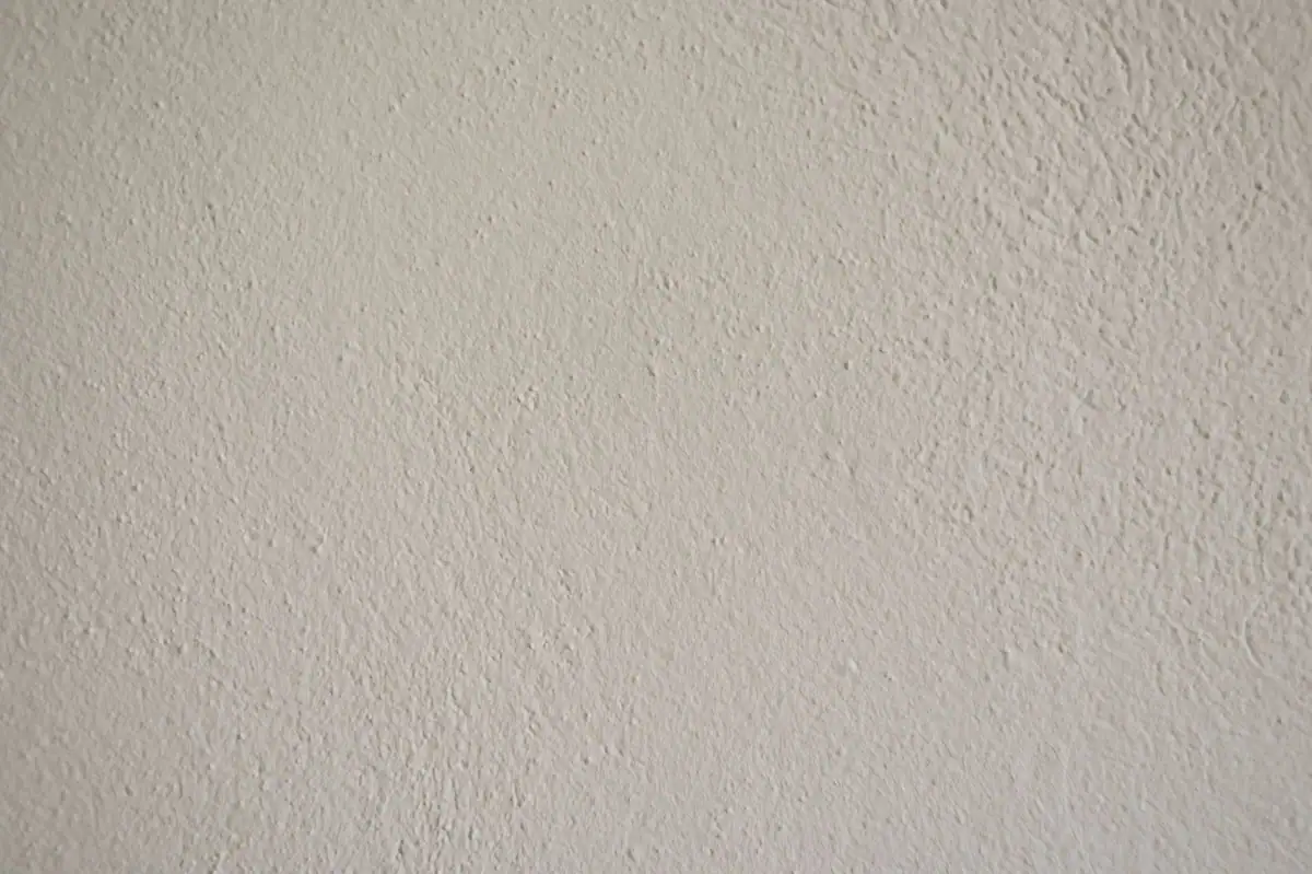 Close view of orange peel wall texture on a cream wall