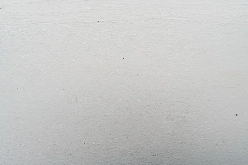 Close view of a smooth wall with a fine roller stipple